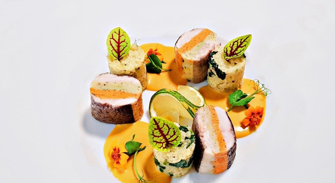 Fish rolls, spinach risotto and saffron sauce